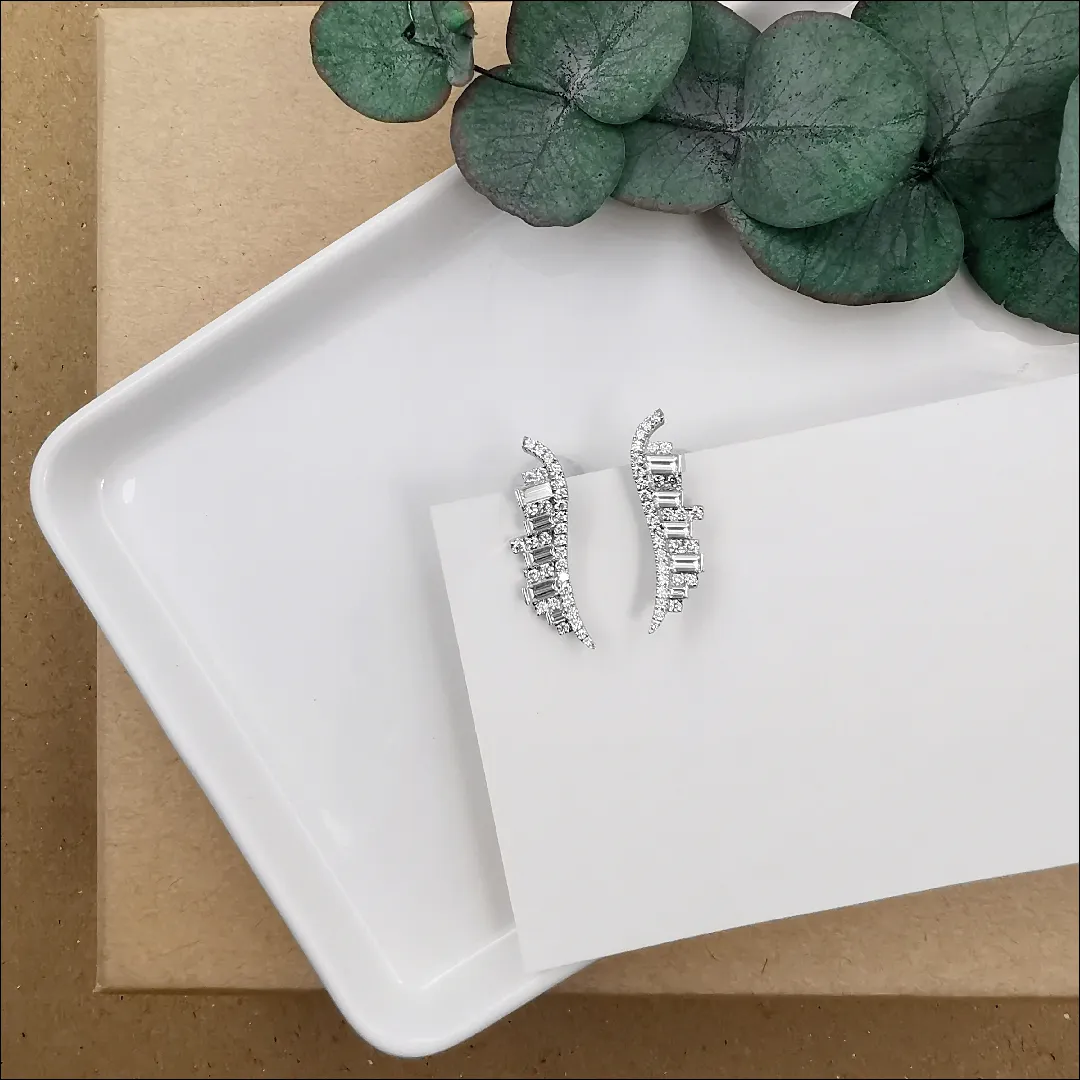 DeGem Vero Amore Earrings Showcasing 18K White Gold with 62 Pieces of Brilliant Round Diamond and 10 Pieces of Baguette Cut Diamonds - DeGem Malaysia