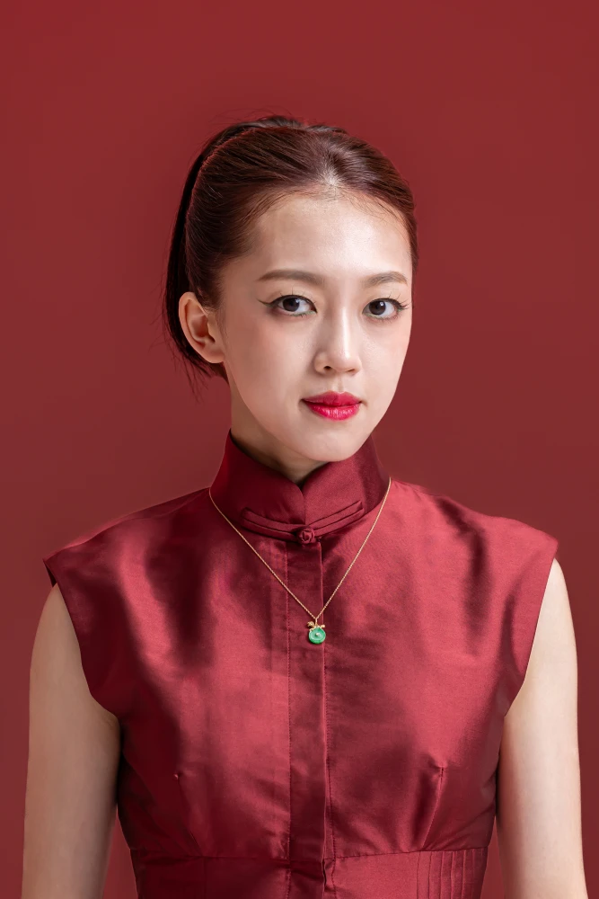 Sydney Chin, SEA Games Wushu Medalist, wearing the DeGem Jadeite Diamond Ruby Horse Pendant — DeGem brand ambassador representing the Jadeite in Motion campaign